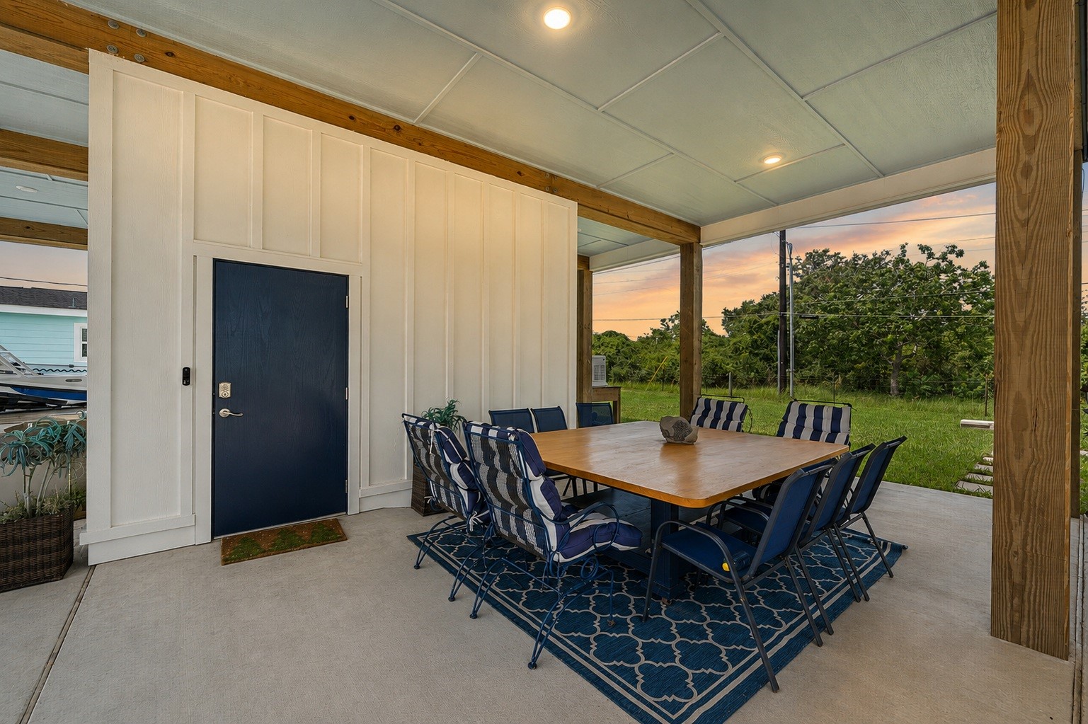 29 Rabbit Drive Port O'Connor, TX 77982 - Photo 15 of 21 Featuring an open-sided architectural layout, this ground-level space offers an expansive slab foundation shaded by overhead ceiling structures and heavy-duty frame posts.