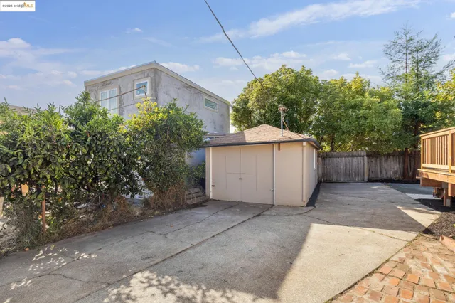 a balcony with wooden floor and outdoor seating