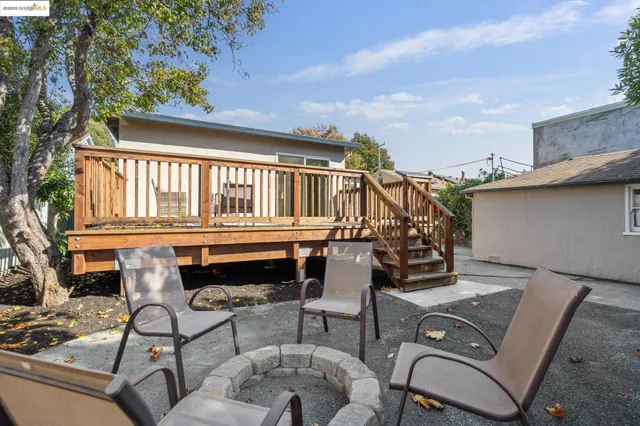 a view of a house with truck parked on a road