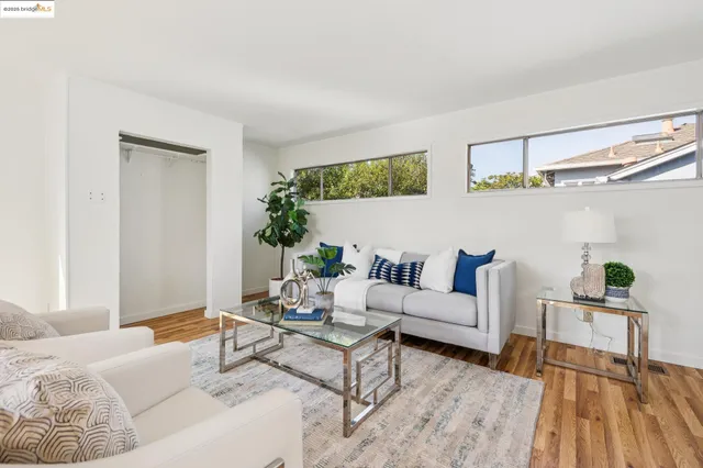 a kitchen with stainless steel appliances granite countertop a sink dishwasher and cabinets with wooden floor
