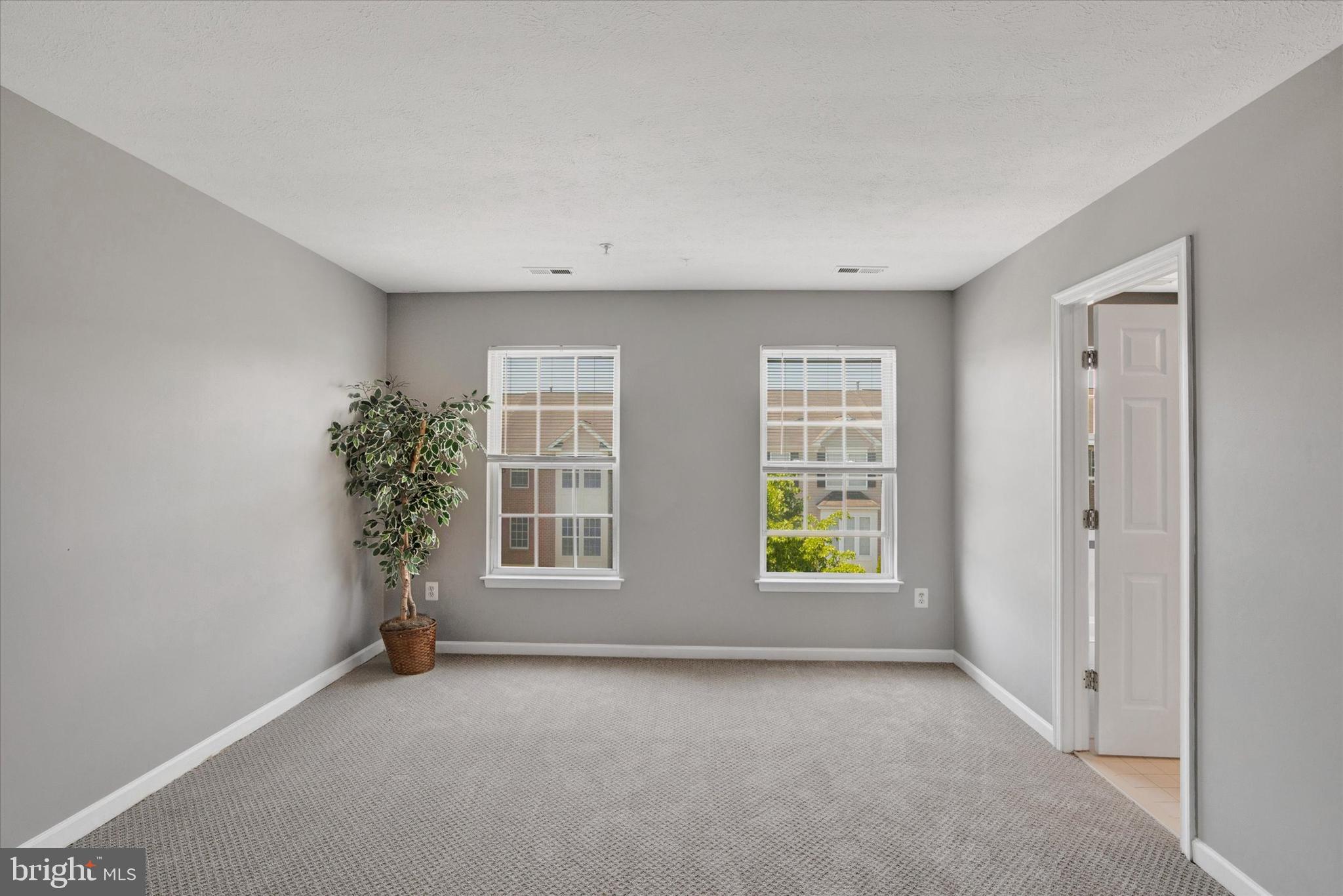 835 Lowe Road Middle River, MD 21220 - Photo 11 of 26 an empty room with windows