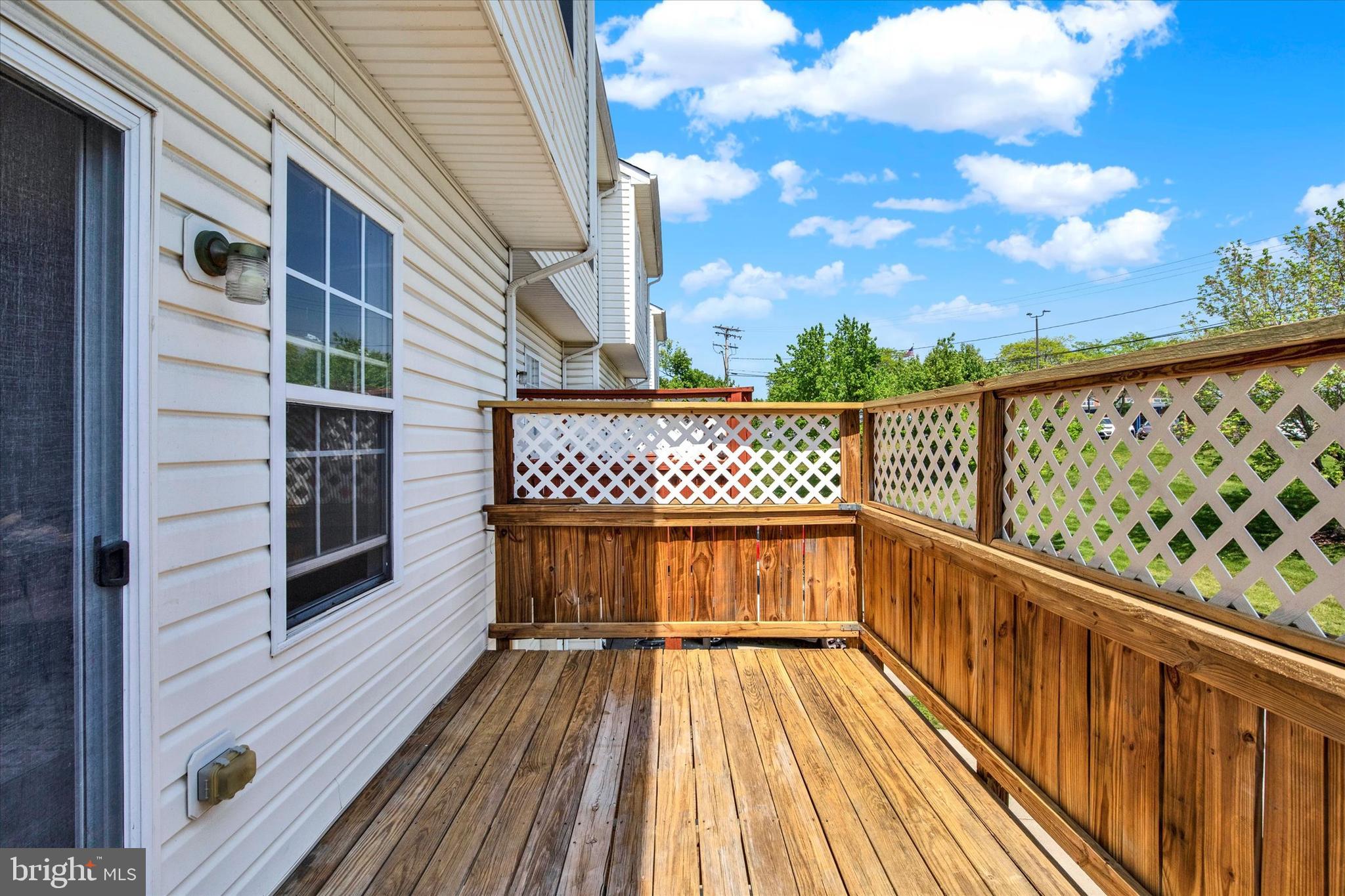 835 Lowe Road Middle River, MD 21220 - Photo 23 of 26 a view of balcony with wooden floor and fence