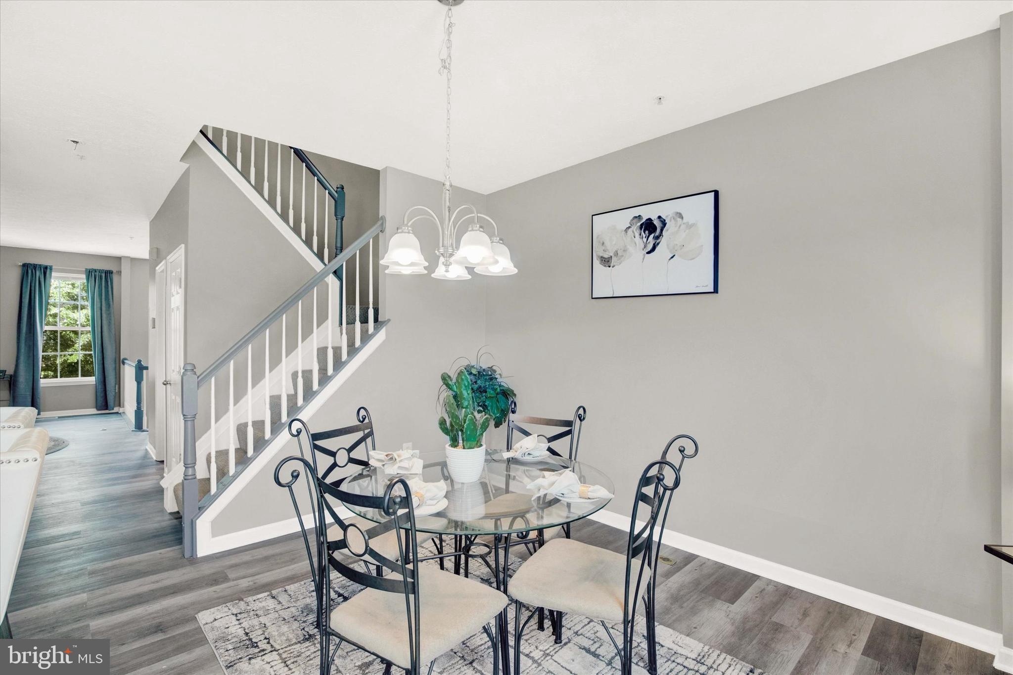 835 Lowe Road Middle River, MD 21220 - Photo 7 of 26 a view of a dining room with furniture and wooden floor
