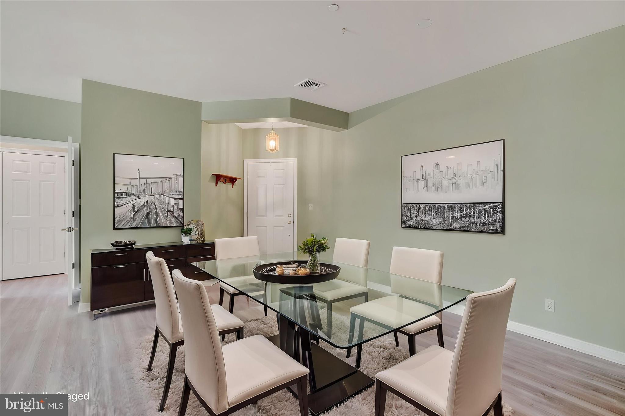 1010 Crest Way, Unit 304 York, PA 17403 - Photo 6 of 24 a view of a dining room with furniture wooden floor and a chandelier