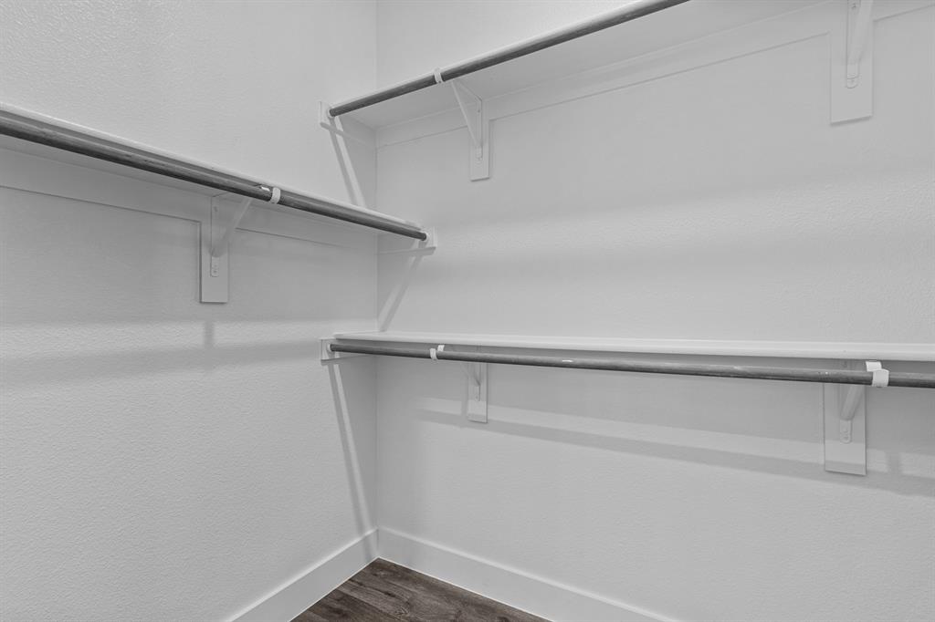 3283 Ganzer Road West, Unit 1105B Denton, TX 76207 - Photo 16 of 37 a view of an empty walk in closet