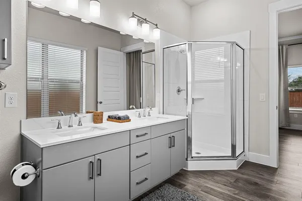 a bathroom with a double vanity sink mirror and double