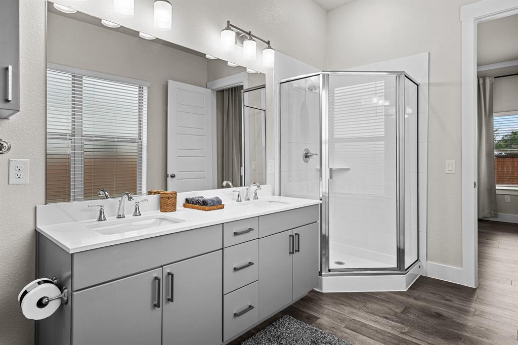 3283 Ganzer Road West, Unit 1105B Denton, TX 76207 - Photo 32 of 37 a bathroom with a double vanity sink mirror and double