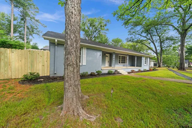 a front view of house with yard and porch