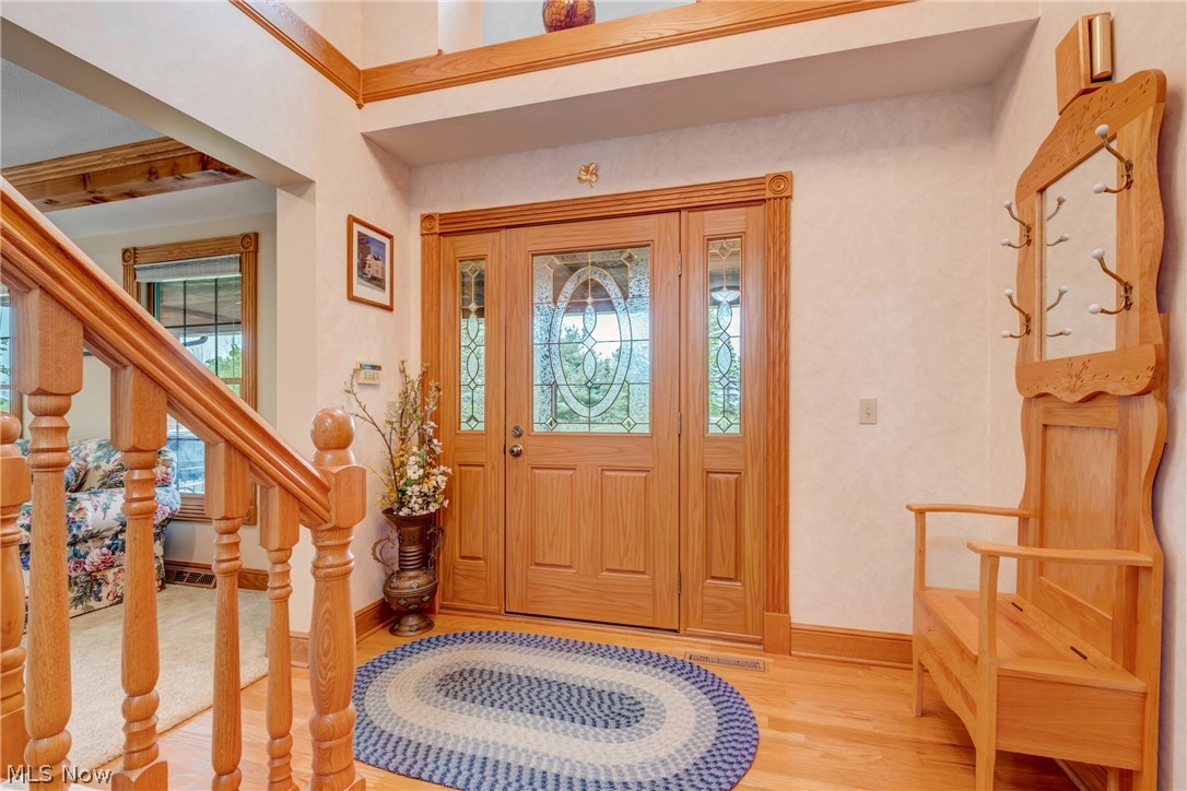 2645 Frost Road Mantua, OH 44255 - Photo 6 of 35 Foyer entrance with light hardwood / wood-style flooring