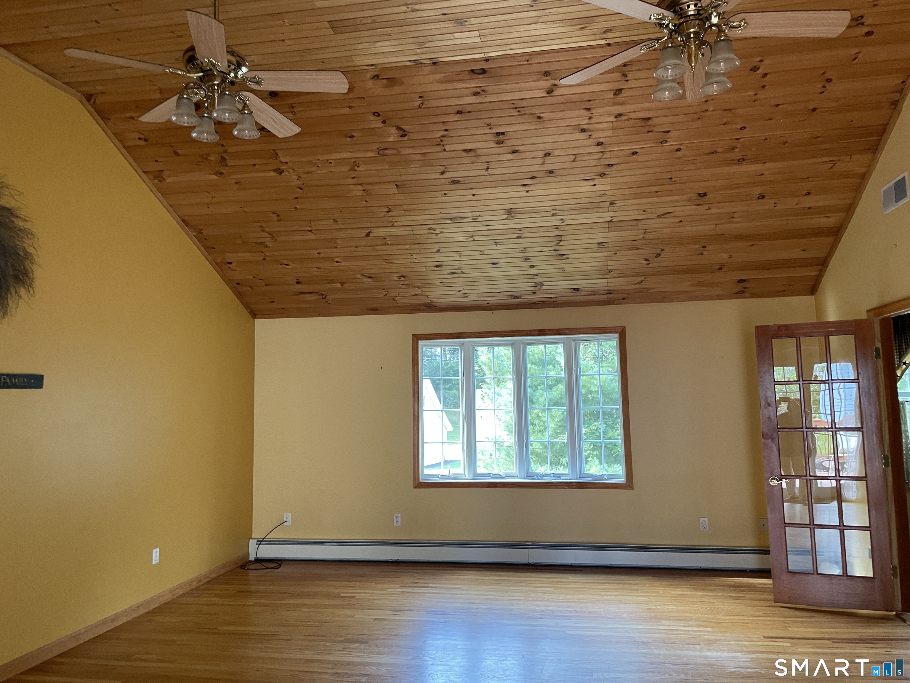 112 Maple Street Seymour, CT 06483 - Photo 13 of 34 Great room, with hardwood floors and cathedral ceiling, offers ample space for large furniture