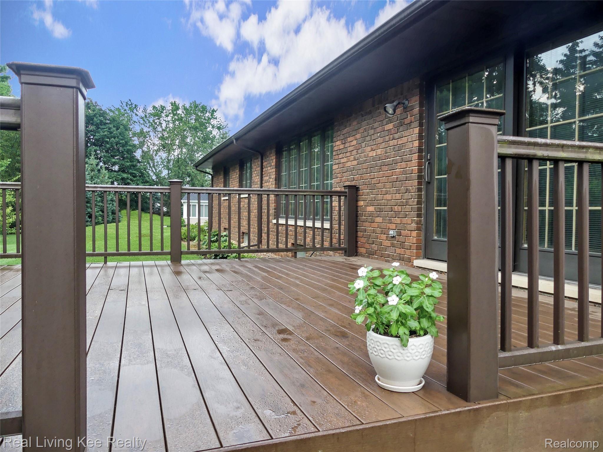 5165 Glengate Road Rochester, MI 48306 - Photo 34 of 38 Large Trex deck off of family room