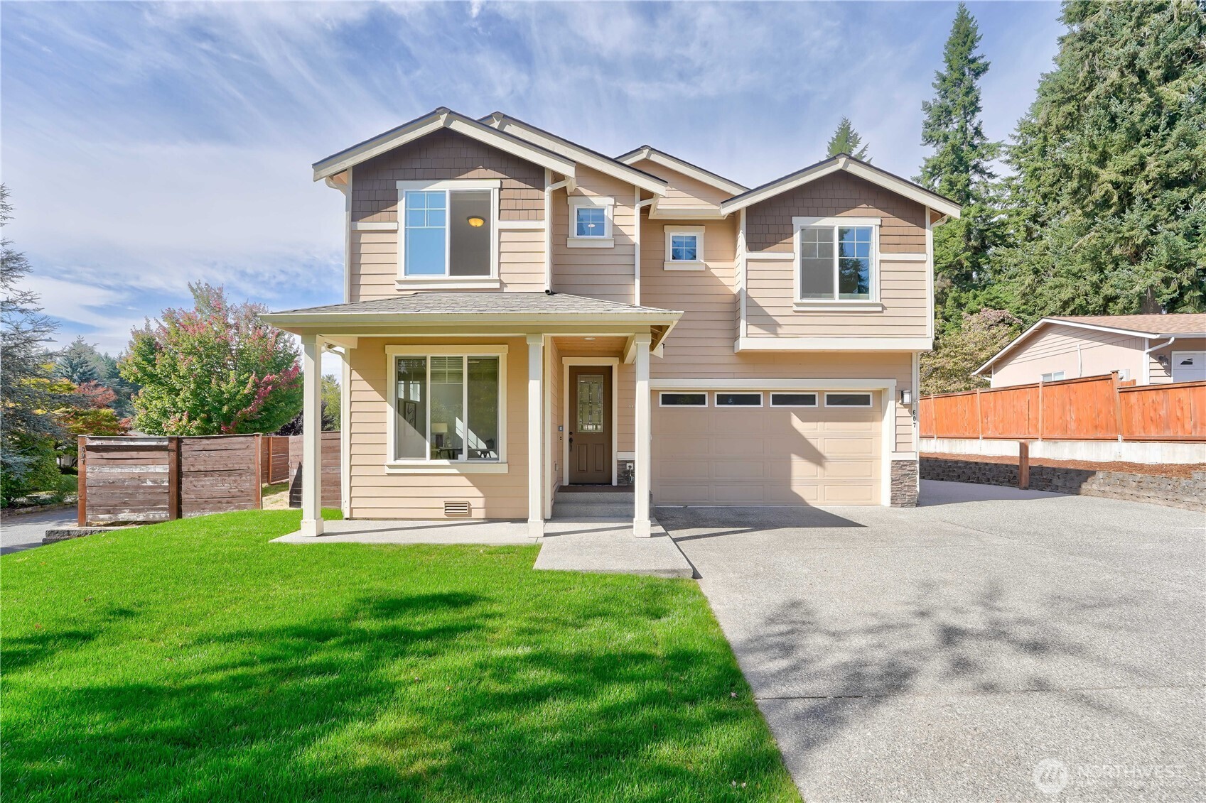 607 217th Street Southwest Bothell, WA 98021 - Photo 1 of 36 a front view of a house with a yard and porch