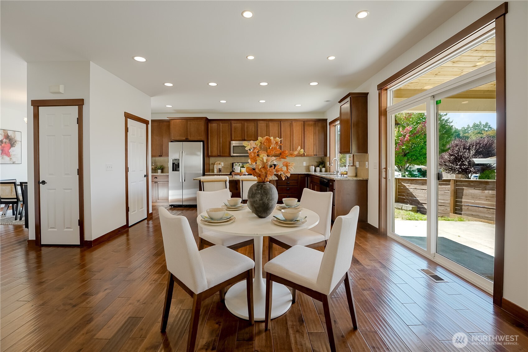 607 217th Street Southwest Bothell, WA 98021 - Photo 11 of 36 a view of a dining room with furniture window and wooden floor