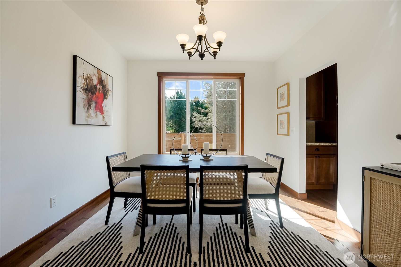 607 217th Street Southwest Bothell, WA 98021 - Photo 12 of 36 a view of a dining room with furniture window and wooden floor