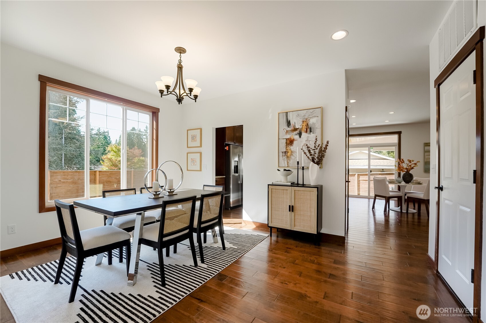 607 217th Street Southwest Bothell, WA 98021 - Photo 13 of 36 a view of a dining room with furniture window and wooden floor