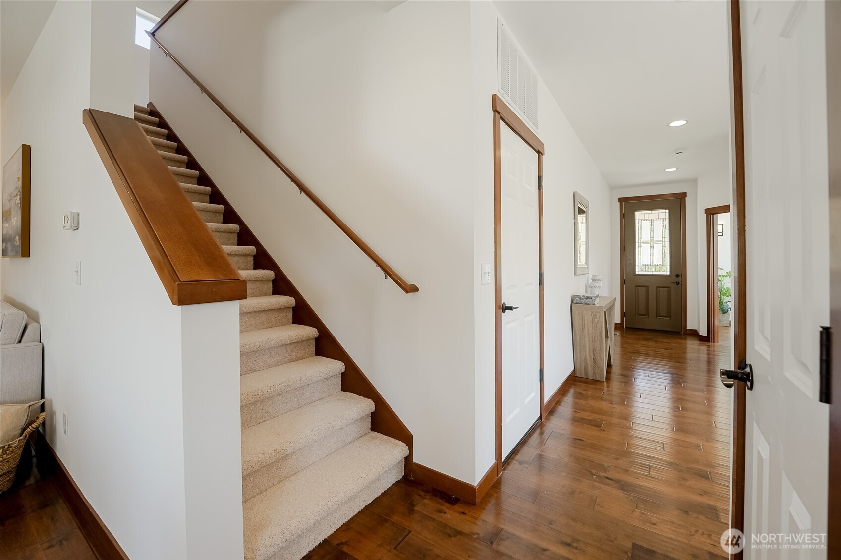 607 217th Street Southwest Bothell, WA 98021 - Photo 16 of 36 a view of a hallway with wooden floor and staircase