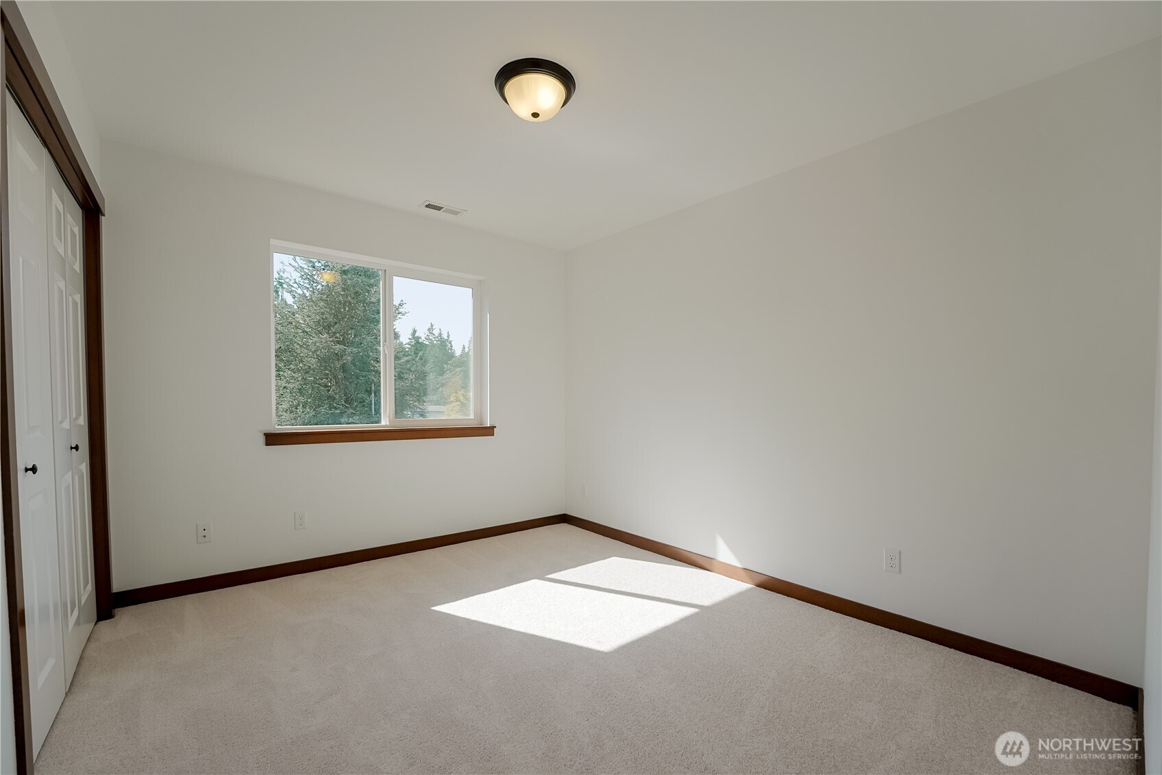 607 217th Street Southwest Bothell, WA 98021 - Photo 24 of 36 an empty room with a window