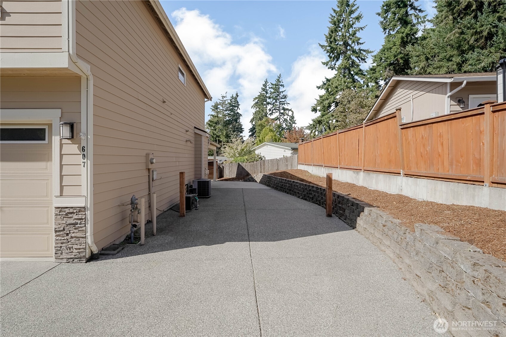 607 217th Street Southwest Bothell, WA 98021 - Photo 31 of 36 a backyard of a house with seating space