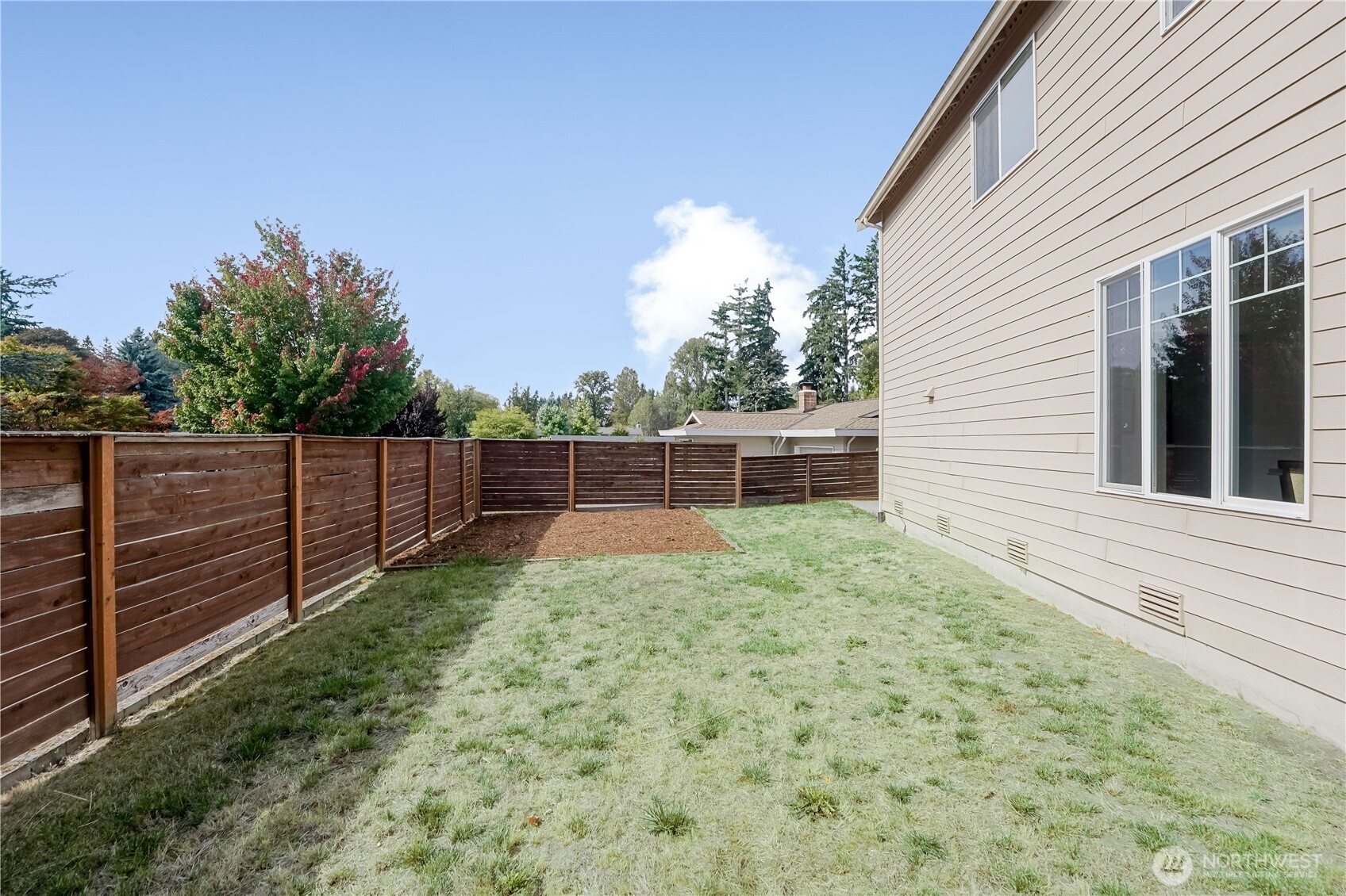 607 217th Street Southwest Bothell, WA 98021 - Photo 33 of 36 a view of backyard with wooden fence