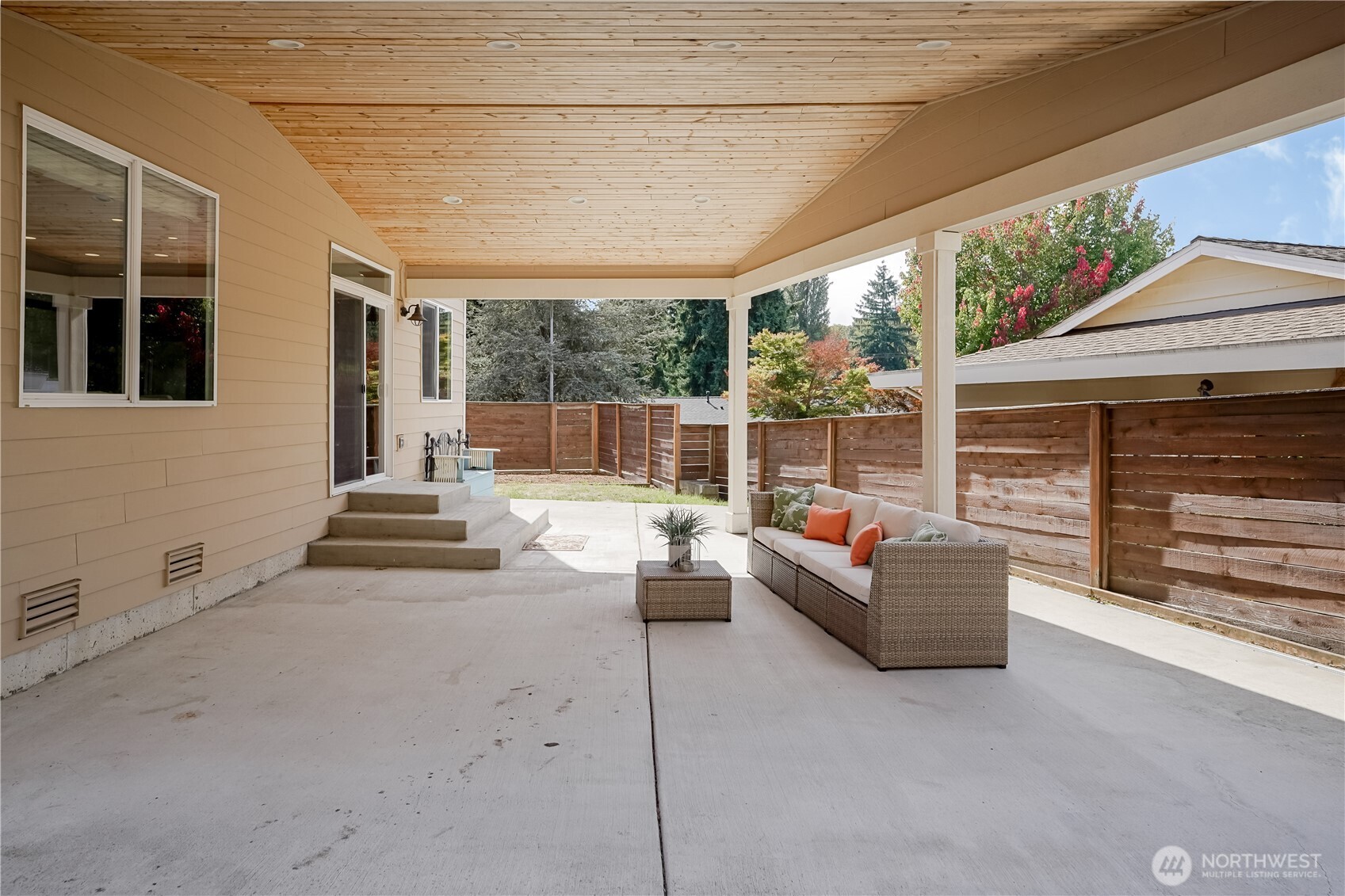 607 217th Street Southwest Bothell, WA 98021 - Photo 35 of 36 a living room with patio furniture and a fireplace