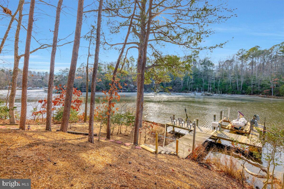263 Frontier Trail Lusby, MD 20657 - Photo 1 of 94 a view of a lake from a roof deck