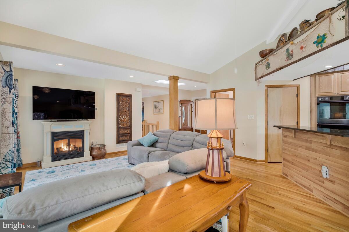 263 Frontier Trail Lusby, MD 20657 - Photo 26 of 94 a living room with furniture and a fireplace or television