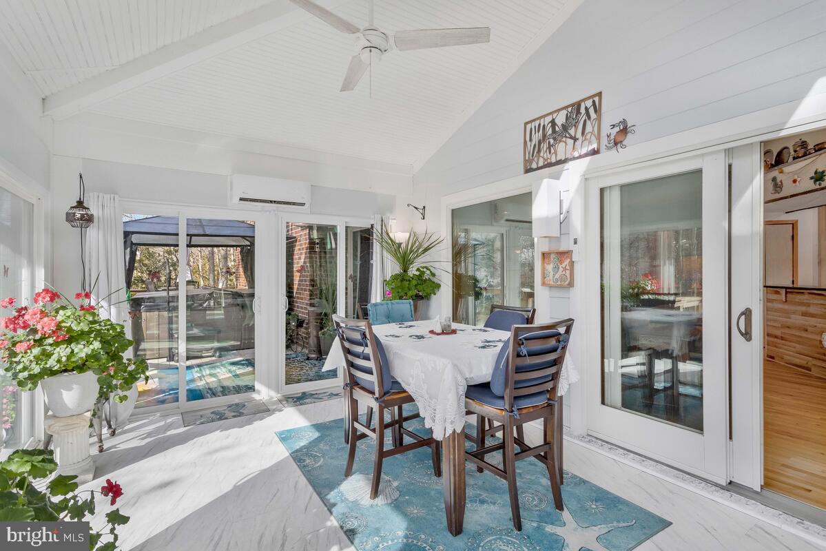263 Frontier Trail Lusby, MD 20657 - Photo 41 of 94 a view of a dining room with furniture window and wooden floor