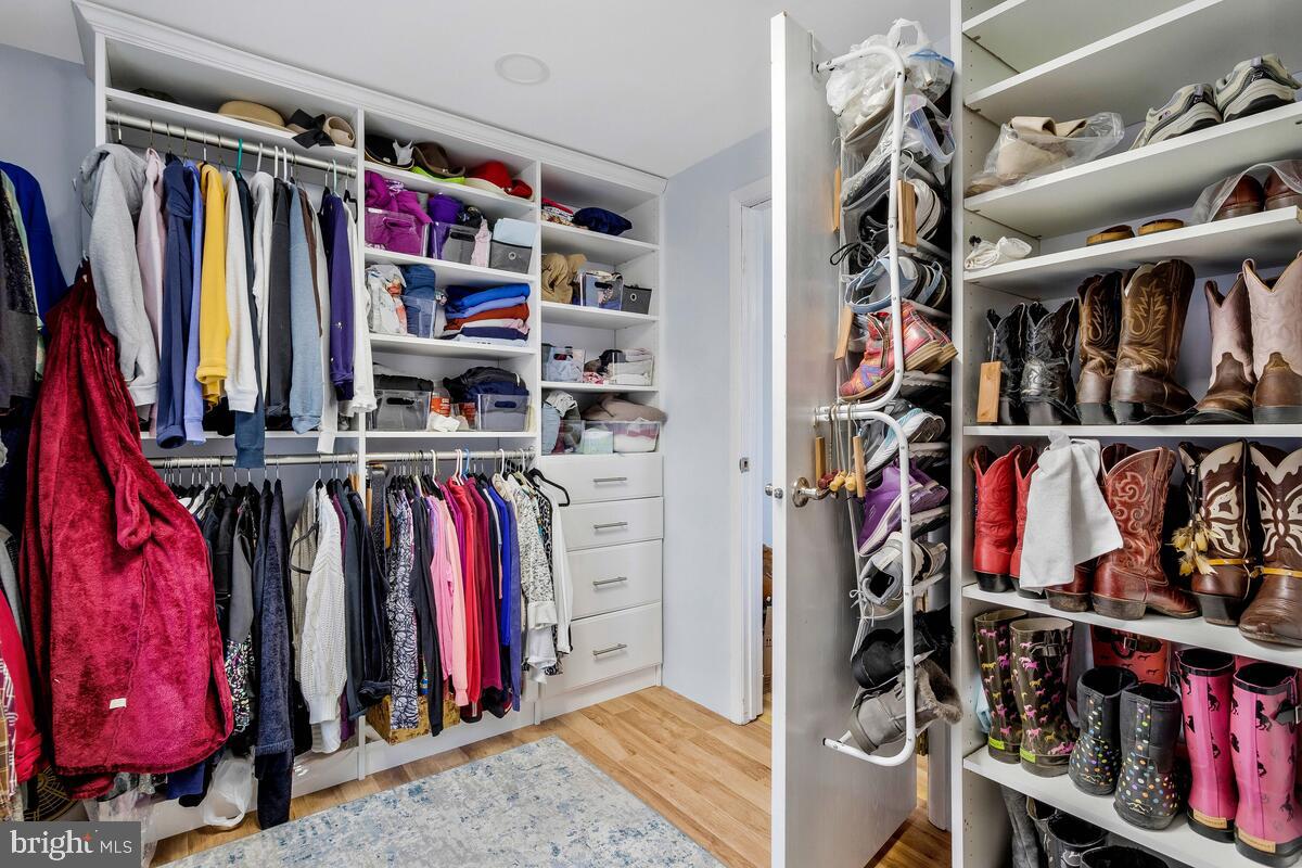 263 Frontier Trail Lusby, MD 20657 - Photo 56 of 94 a view of walk in closet with clothes