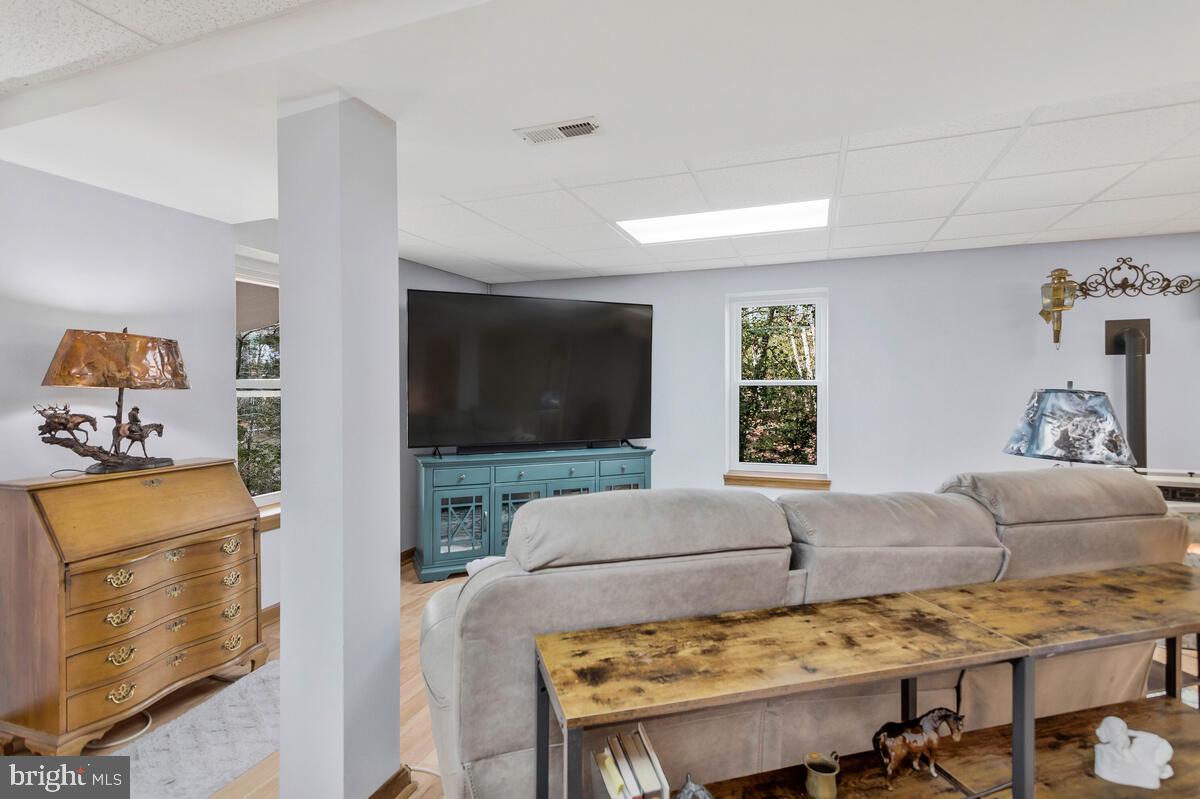 263 Frontier Trail Lusby, MD 20657 - Photo 65 of 94 a living room with furniture and a flat screen tv