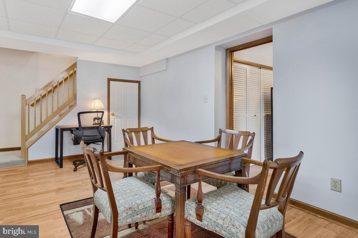 263 Frontier Trail Lusby, MD 20657 - Photo 67 of 94 a view of a dining room with furniture and wooden floor