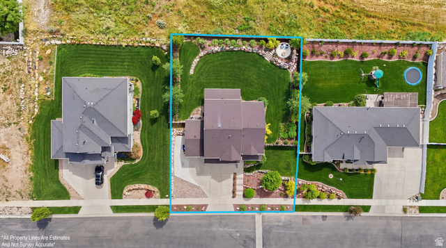 338 Windy Rdg Drive Smithfield, UT 84335 - Photo 59 of 63 Expansive property featuring a multi-level roofline, extensive front and rear lawns, and mature landscaping