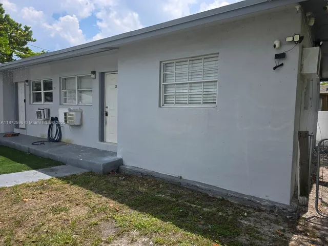 a view of a backyard of a house