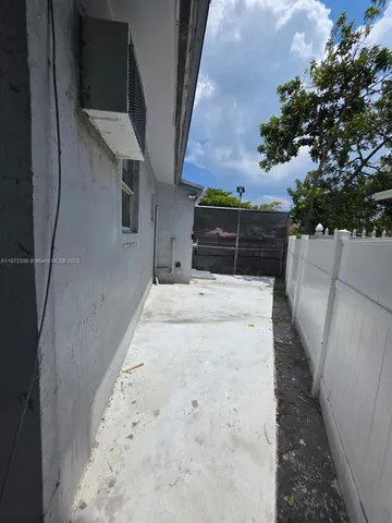 a view of balcony with wooden floor