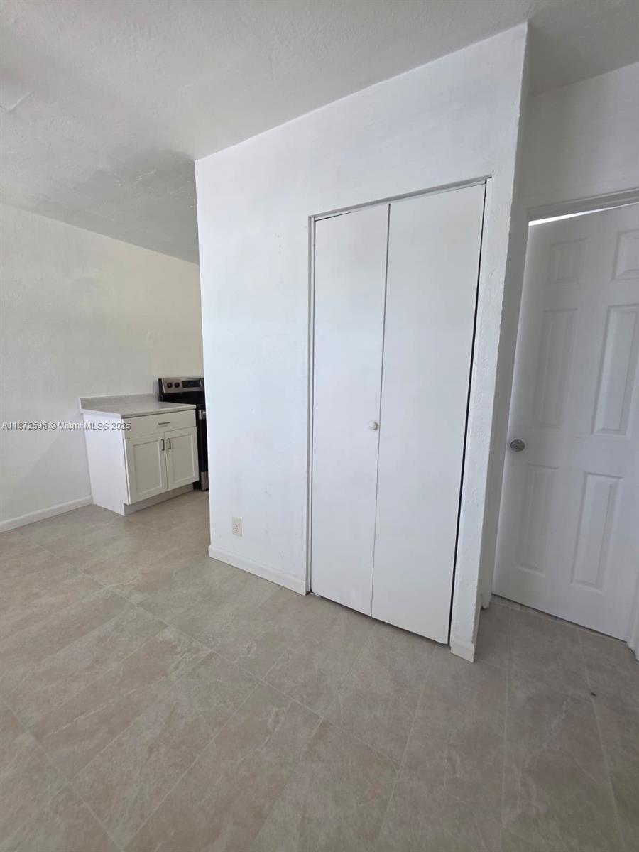 511 Northwest 4th Avenue, Unit 2 Hallandale Beach, FL 33009 - Photo 6 of 28 a view of an empty room