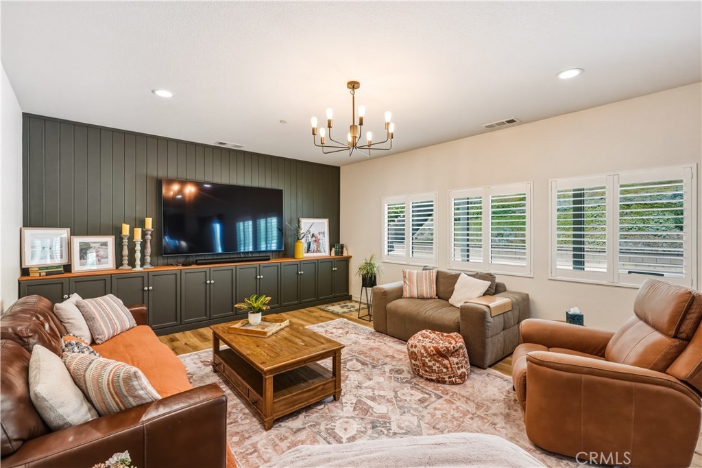 29853 White Ridge Road Winchester, CA 92596 - Photo 17 of 61 living room with built in cabinets and plantation shutters