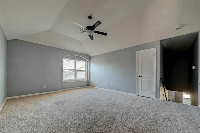 a view of room window and ceiling fan