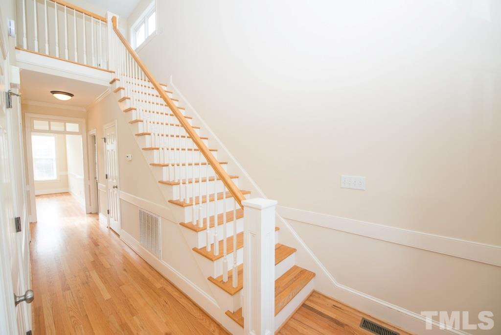 4528 Deer Stream Lane Raleigh, NC 27603 - Photo 4 of 25 Dramatic two-story foyer with hardwoods going up the staircase.