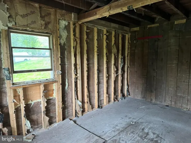 a bathroom with a glass door shower and a sink
