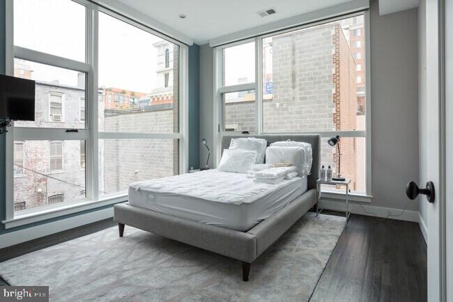 a bedroom with a bed and window