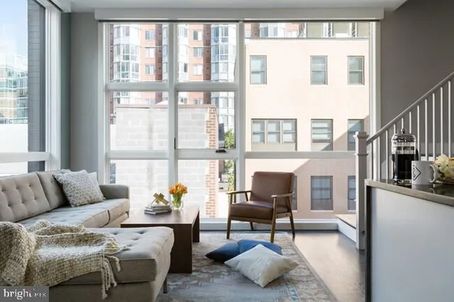 a living room with furniture and a large window
