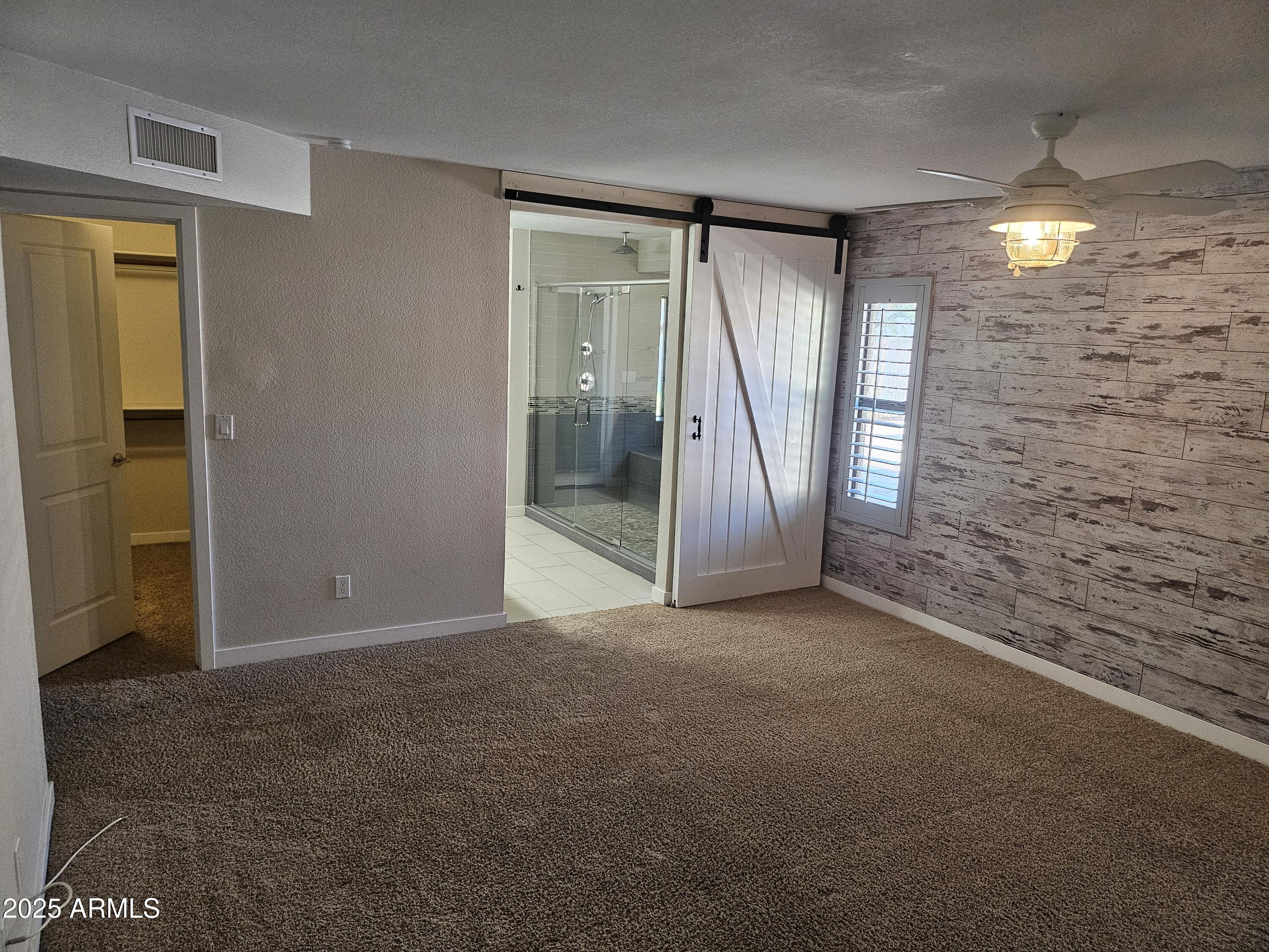 6002 East Marconi Avenue Scottsdale, AZ 85254 - Photo 15 of 29 a view of an empty room with glass door