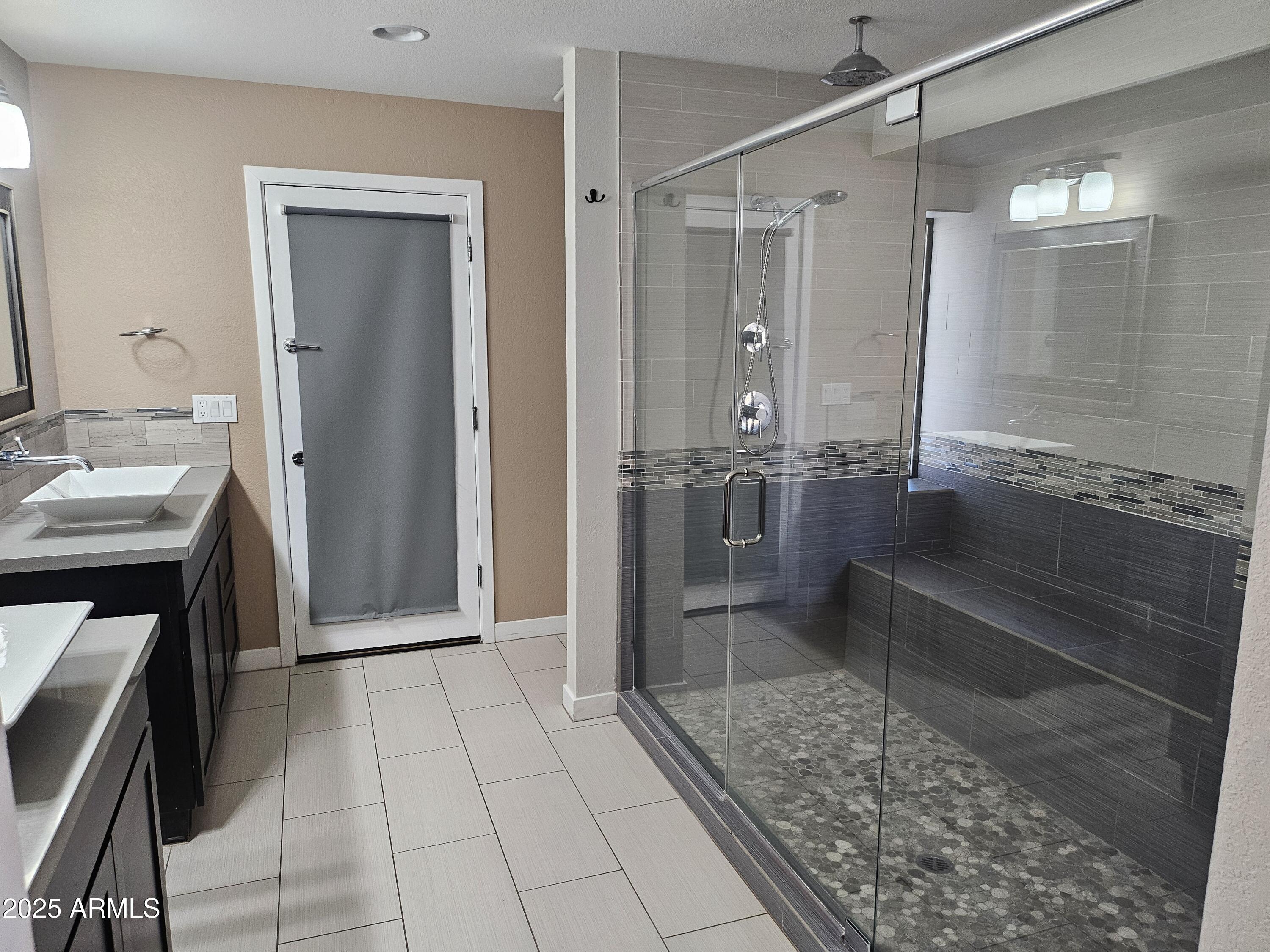 6002 East Marconi Avenue Scottsdale, AZ 85254 - Photo 17 of 29 a bathroom with a granite countertop sink a mirror and a shower
