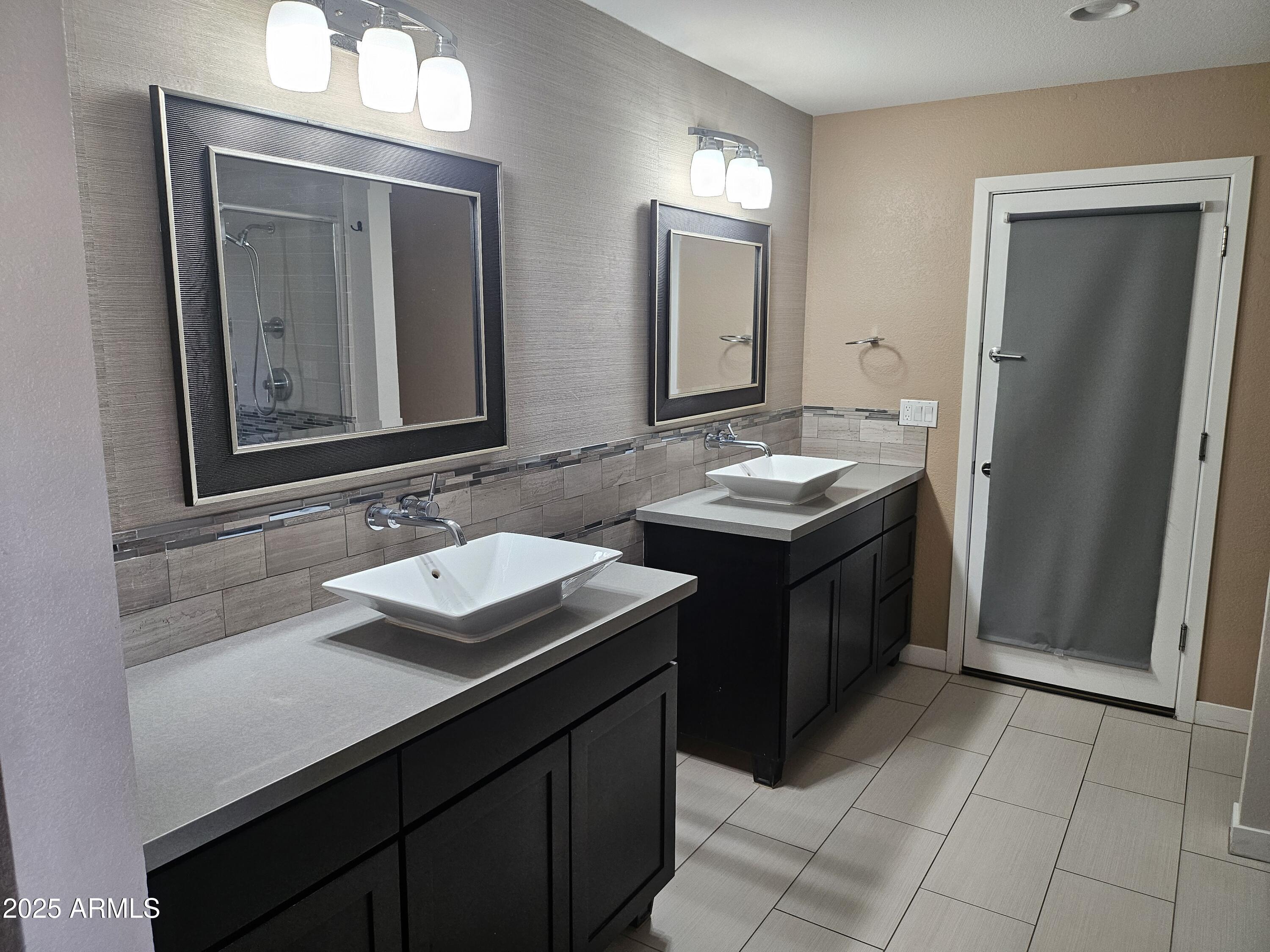 6002 East Marconi Avenue Scottsdale, AZ 85254 - Photo 18 of 29 a bathroom with a sink and a mirror