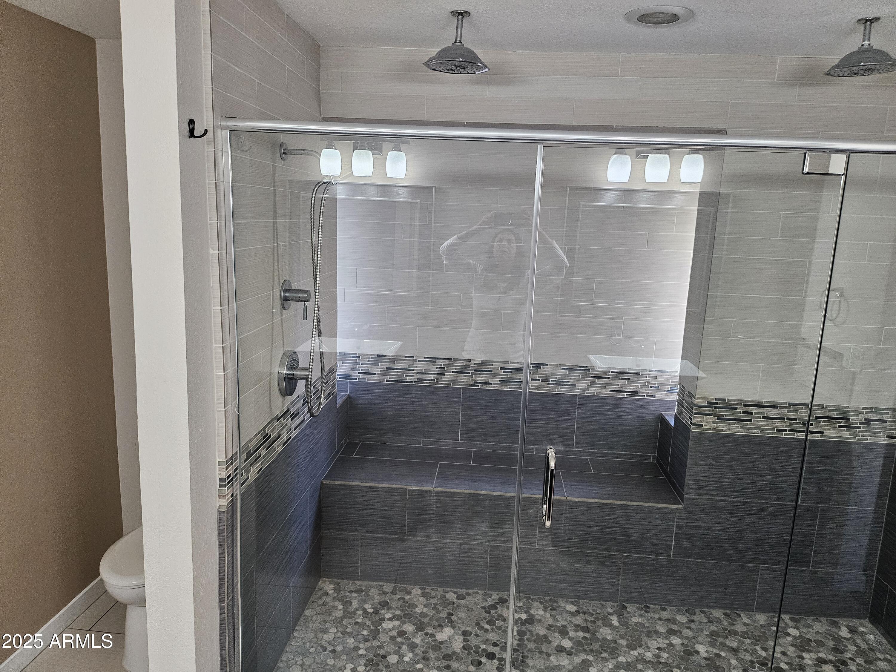 6002 East Marconi Avenue Scottsdale, AZ 85254 - Photo 19 of 29 a bathroom with a glass door shower