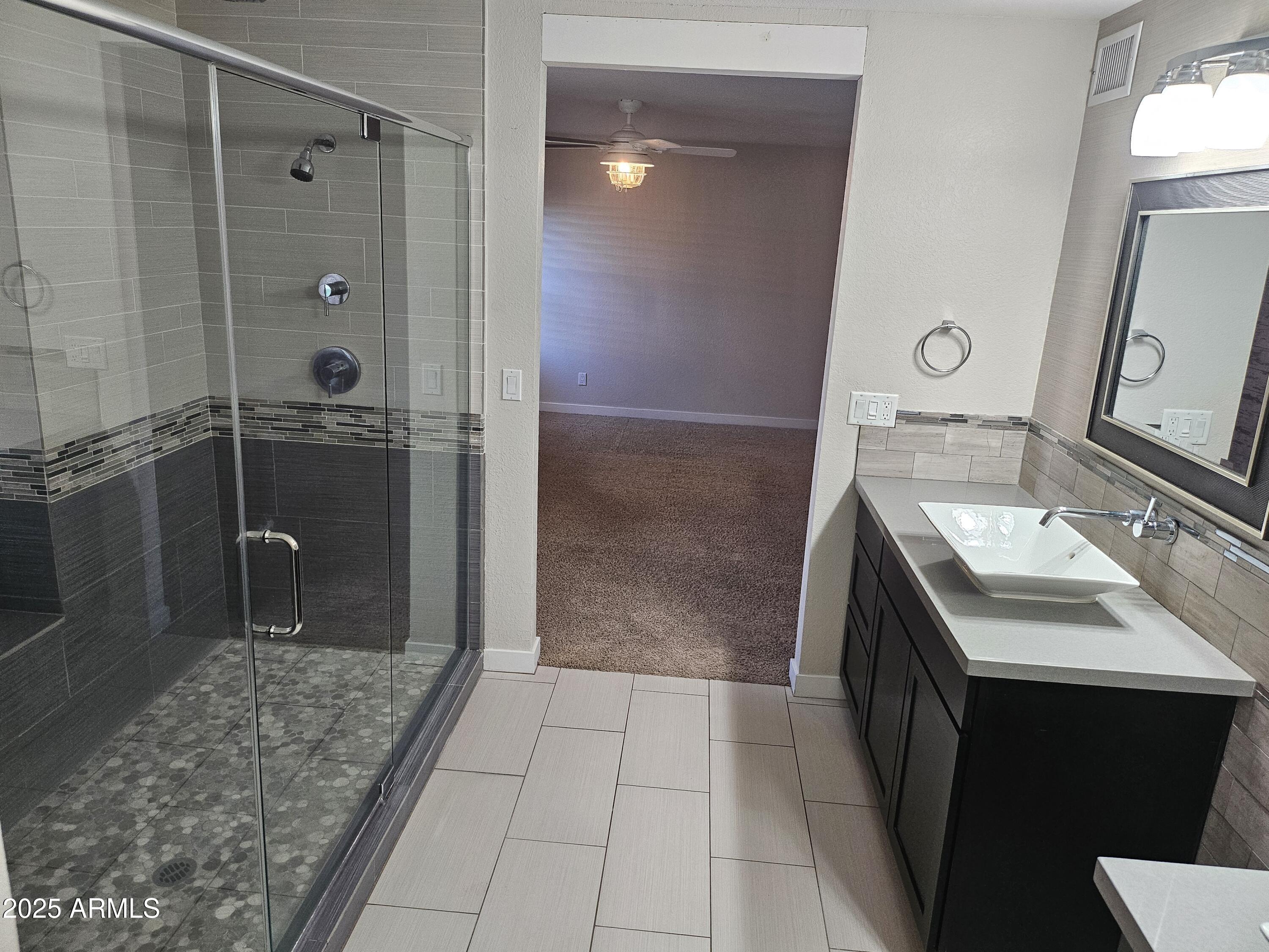 6002 East Marconi Avenue Scottsdale, AZ 85254 - Photo 20 of 29 a bathroom with a sink a toilet and shower