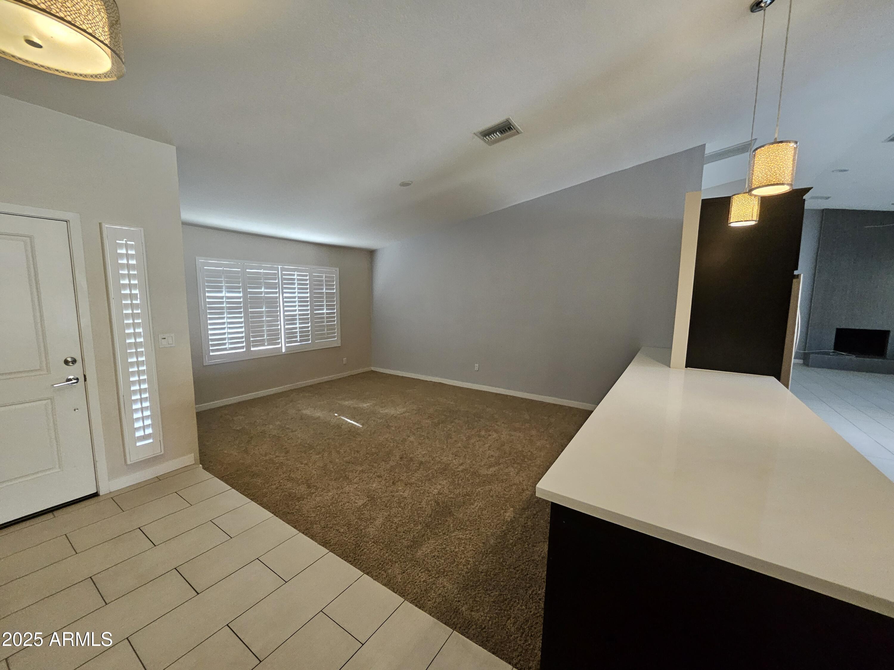 6002 East Marconi Avenue Scottsdale, AZ 85254 - Photo 2 of 29 a view of an empty room and window