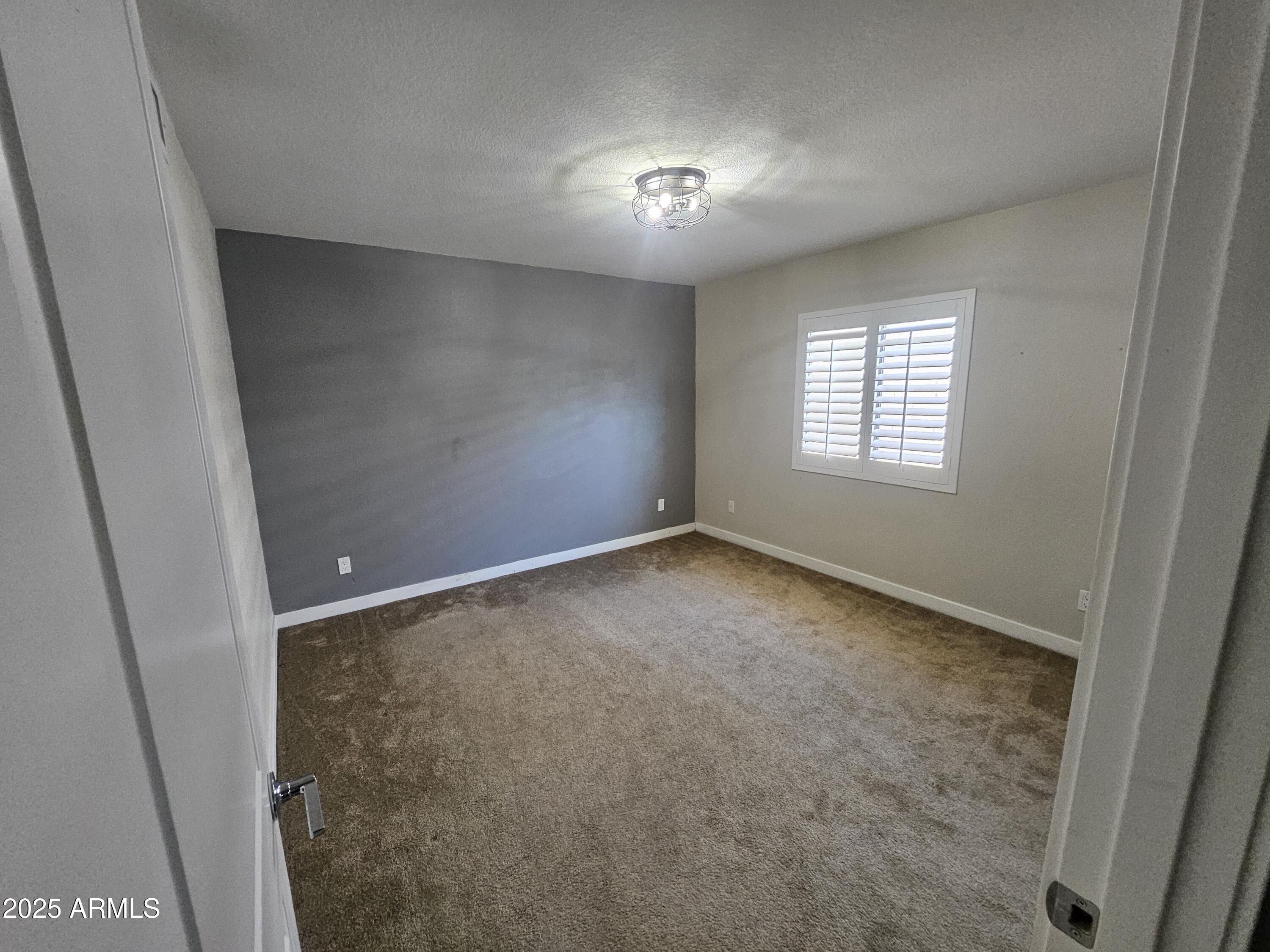 6002 East Marconi Avenue Scottsdale, AZ 85254 - Photo 21 of 29 a view of an empty room with a window