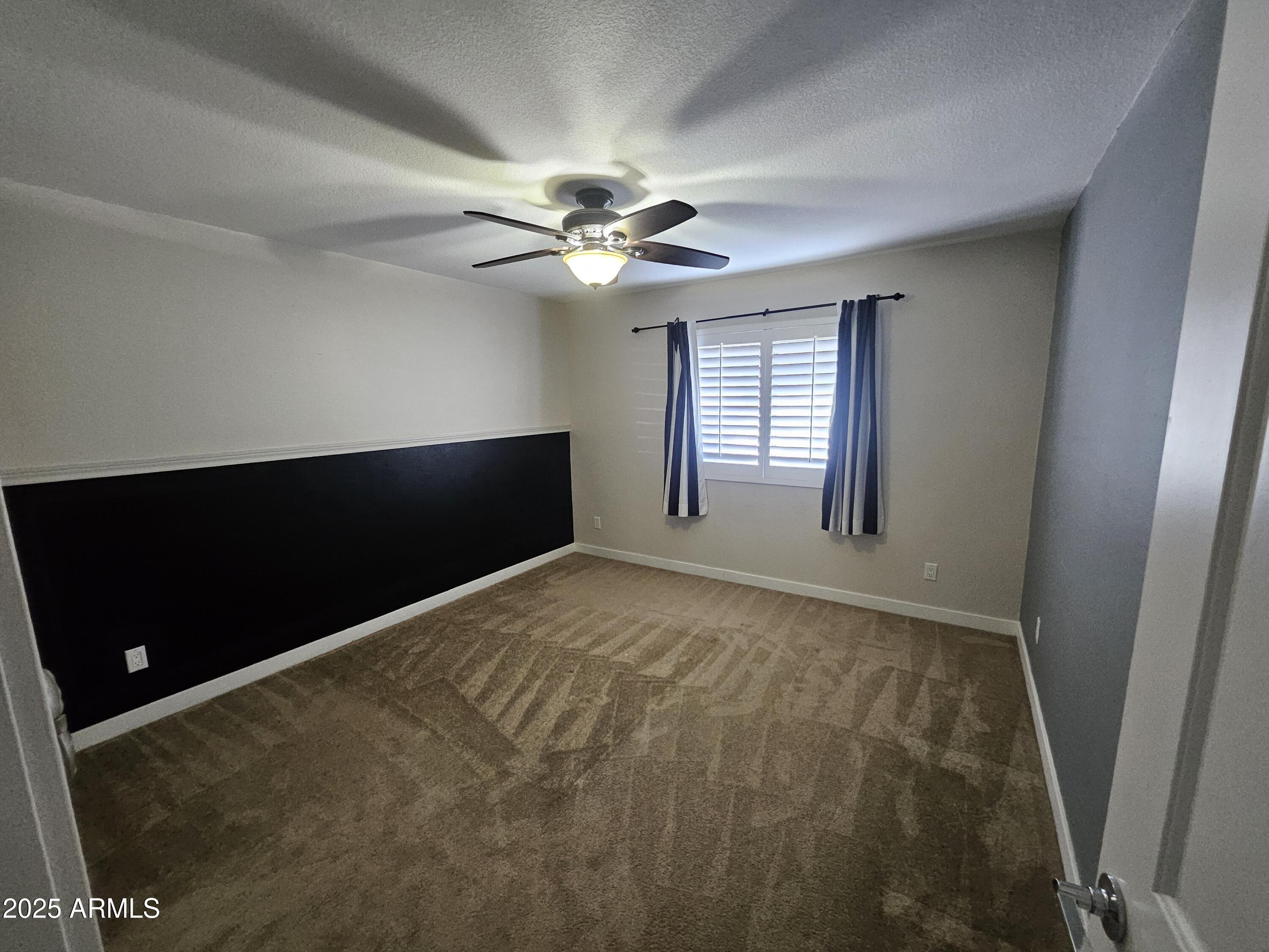 6002 East Marconi Avenue Scottsdale, AZ 85254 - Photo 22 of 29 a view of an empty room with a window