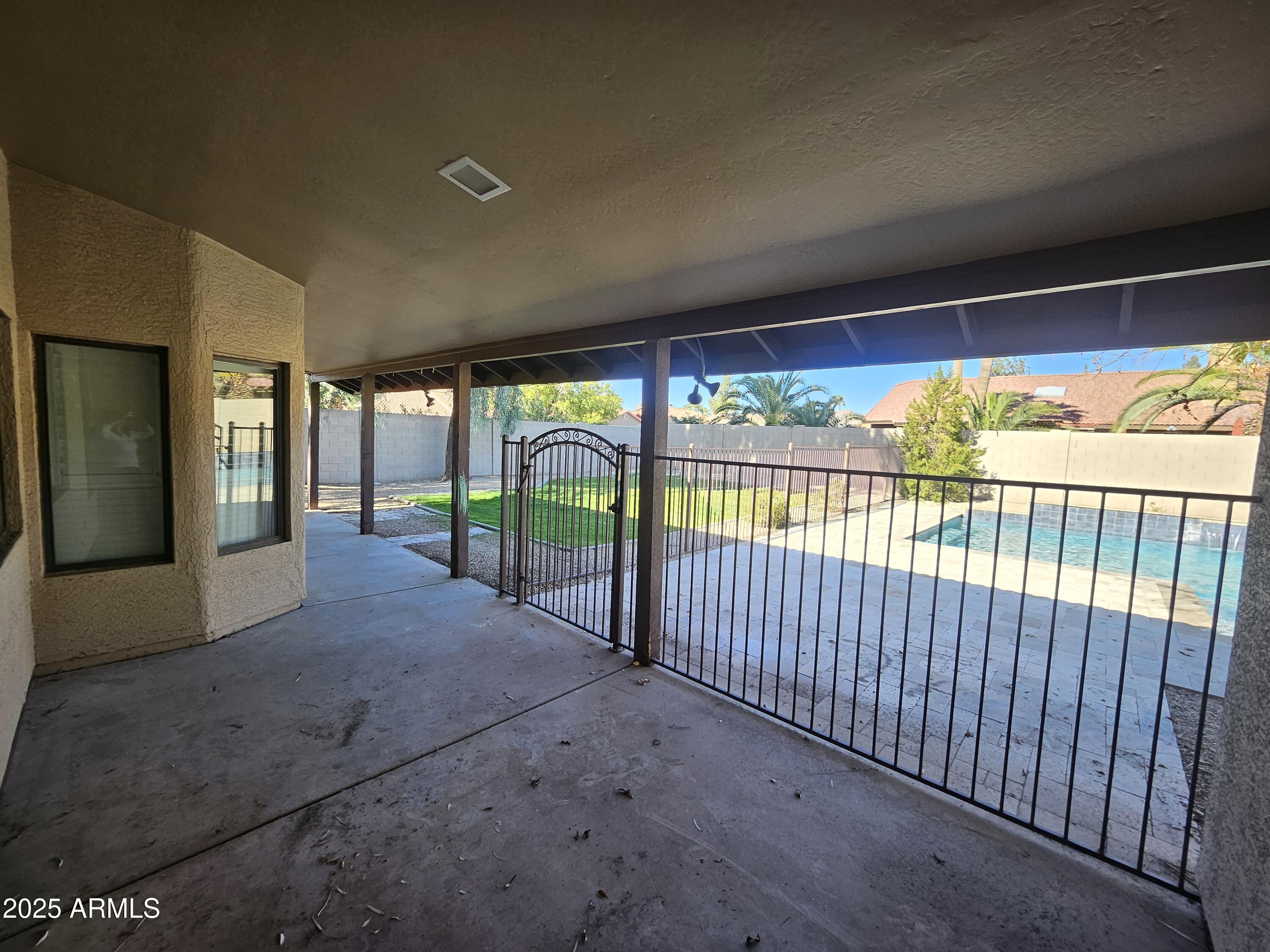 6002 East Marconi Avenue Scottsdale, AZ 85254 - Photo 27 of 29 a view of porch with a floor to ceiling window and outside view
