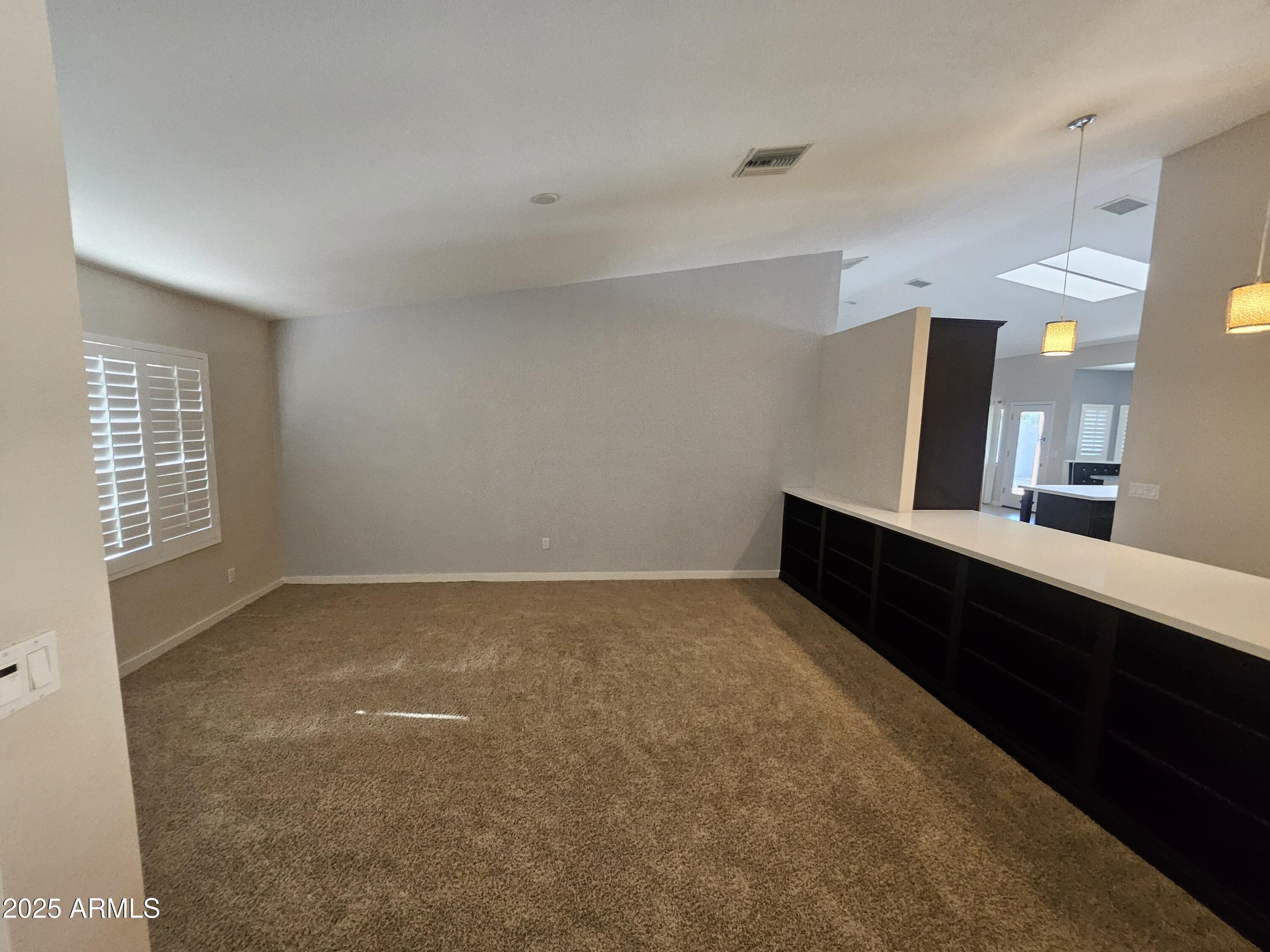 6002 East Marconi Avenue Scottsdale, AZ 85254 - Photo 4 of 29 a view of an empty room with window